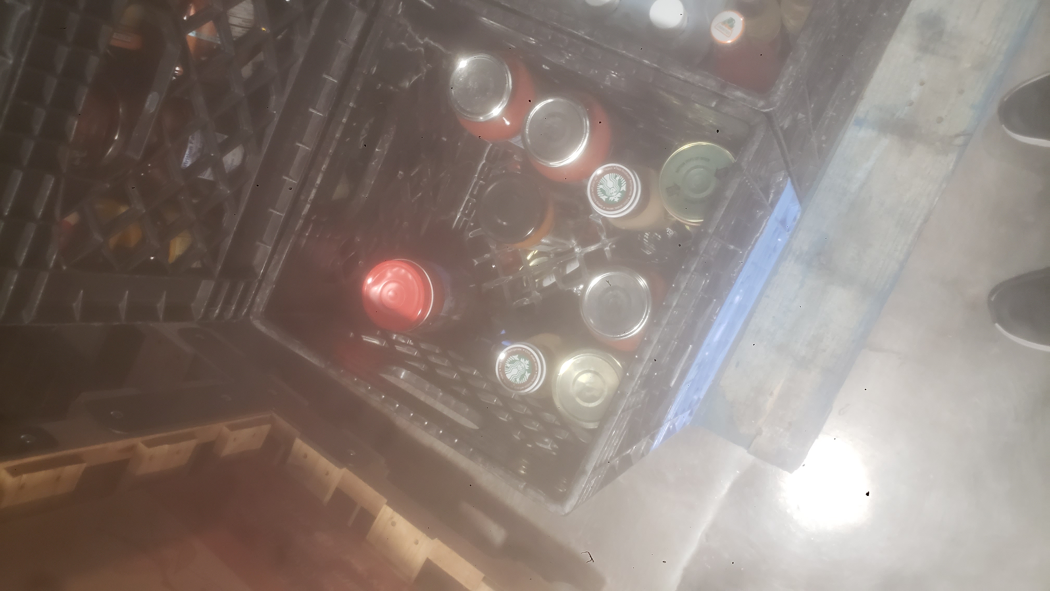 Glass jars in a crate.